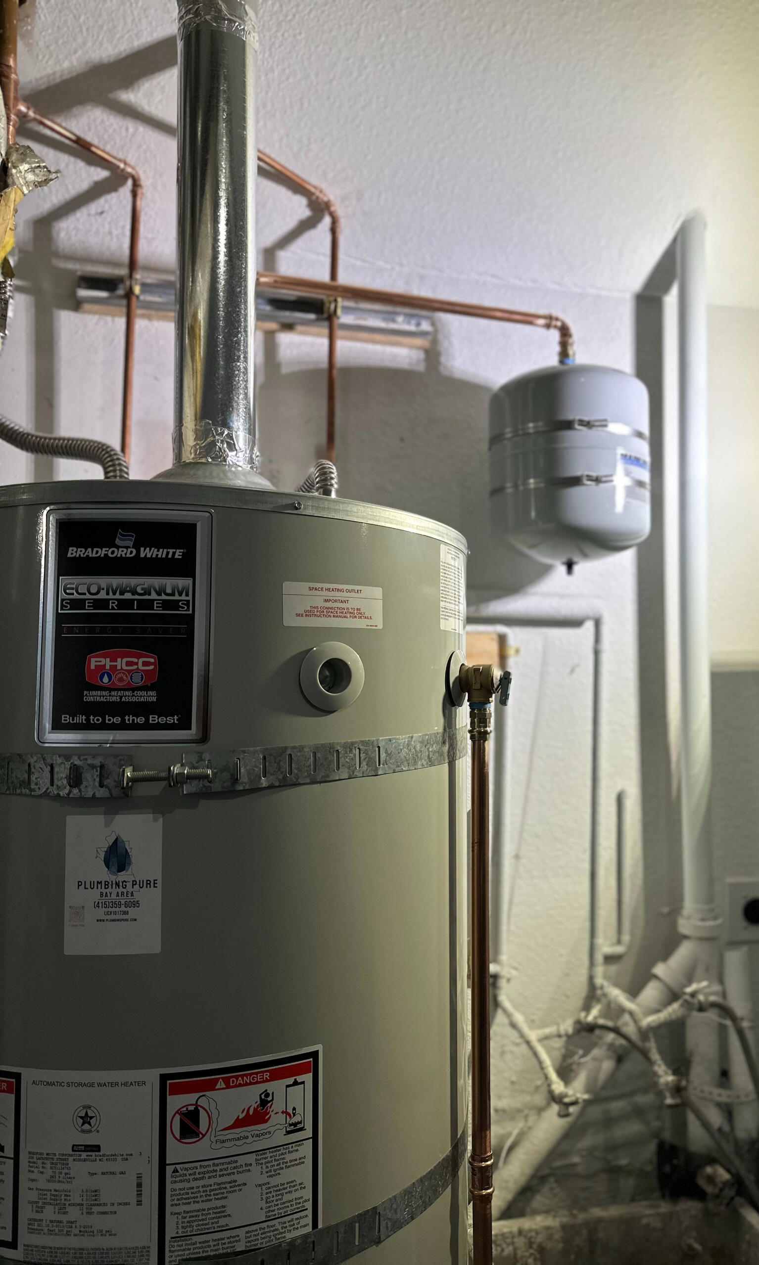 Tank water heater installed in garage