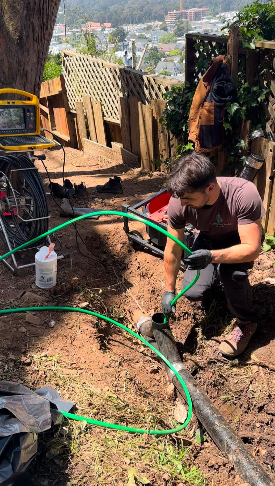 Plumber hydro-jetting the sewer lateral